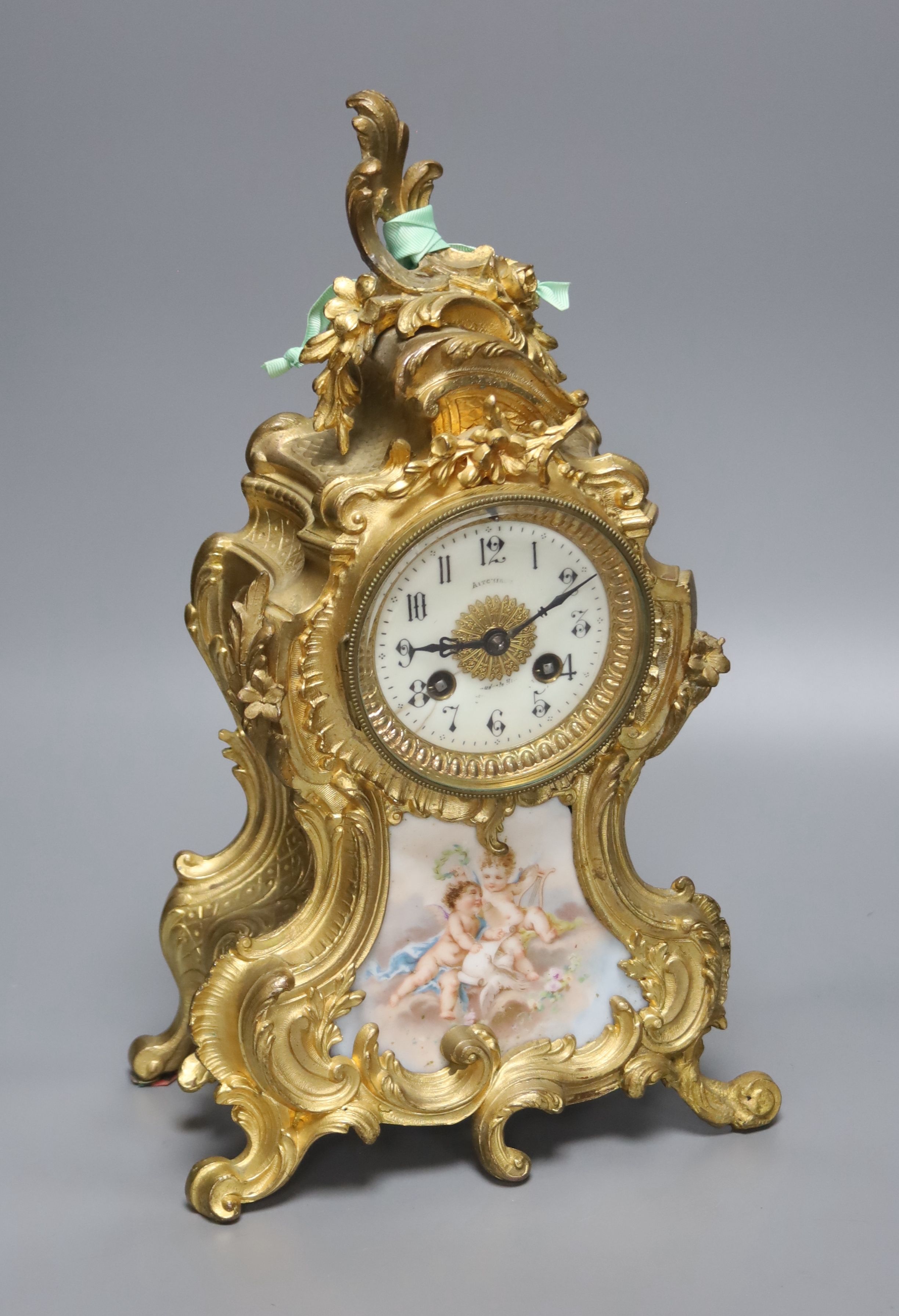 An early 20th century French gilt metal and porcelain eight day mantel clock, height 37cm